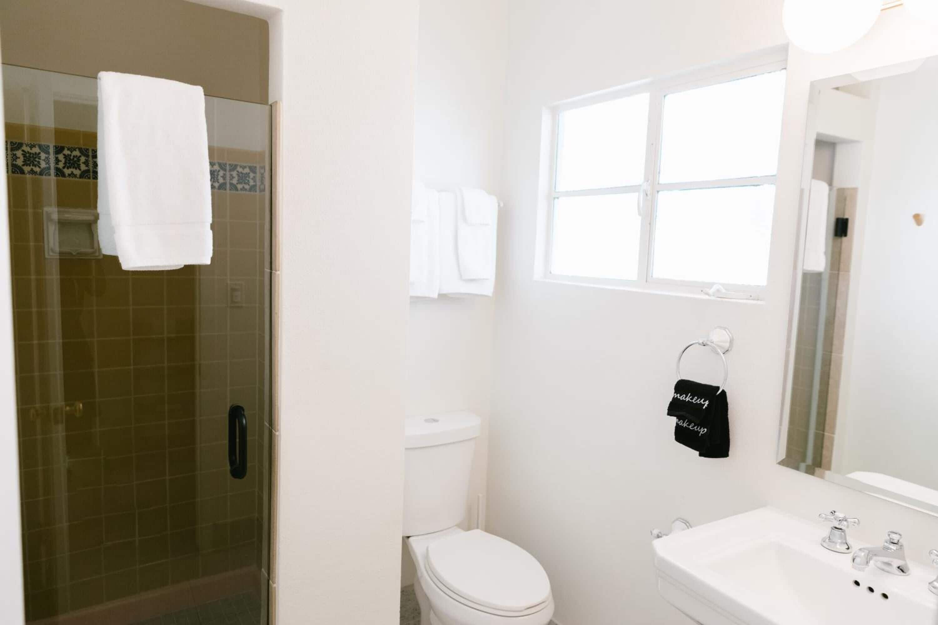 rainfall showerhead, designer toiletries, hair dryer, bathrobes