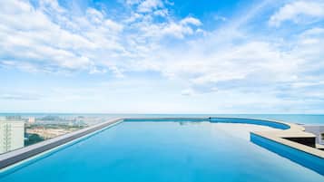 Seasonal outdoor pool, open 6:00 AM to 7:00 PM, pool loungers
