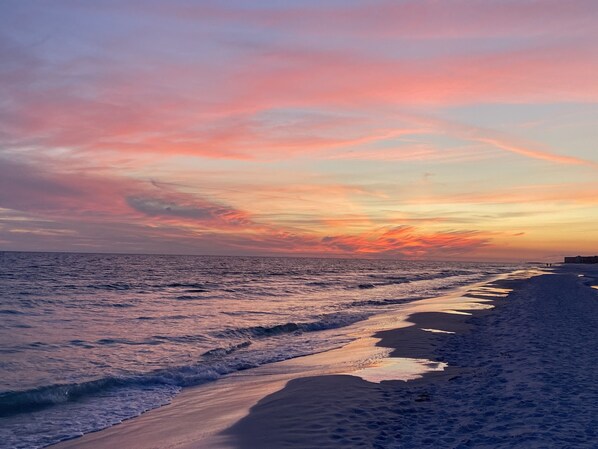 A beach with a sunset.
