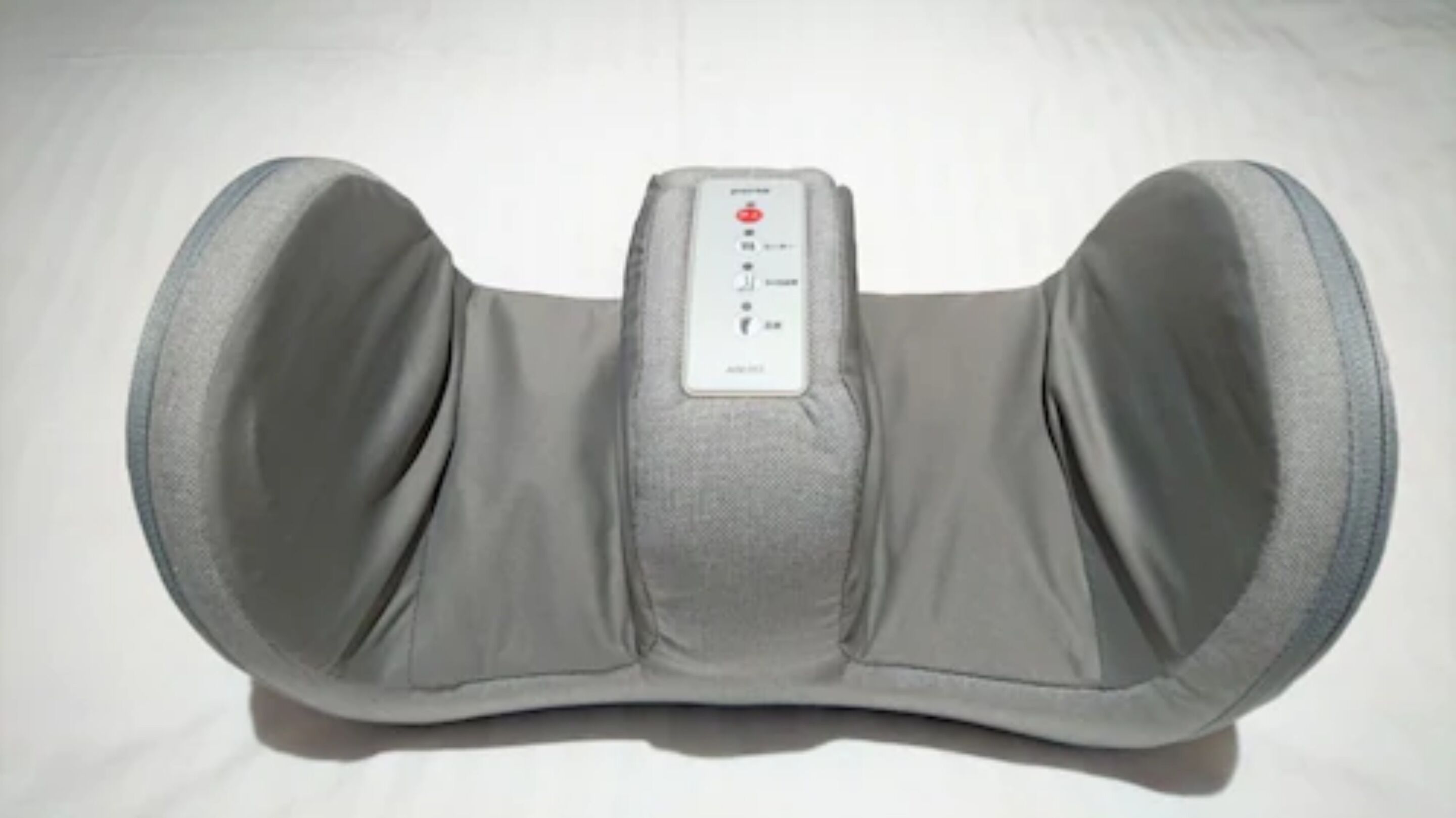 A gray massage chair with a control panel.