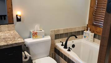 Bathtub, hair dryer, towels, soap