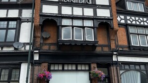A traditional half-timbered building with a large bay window, a black door, and a number '19' sign. - 19 Station Road (Henley-on-Thames)