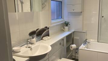 Shower, free toiletries, hair dryer, slippers