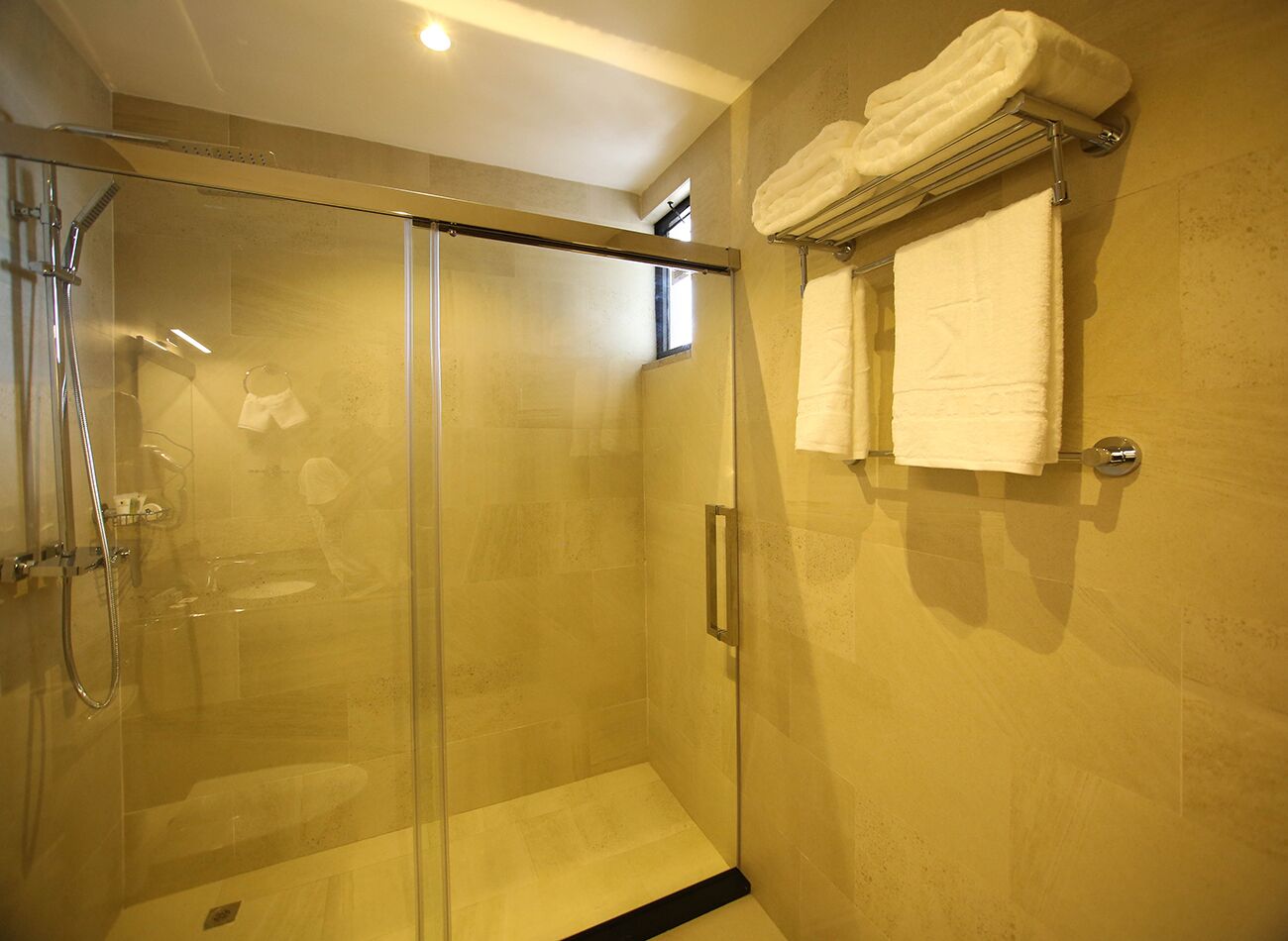 rainfall showerhead, designer toiletries, hair dryer, bathrobes