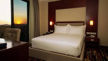 Premium bedding, down comforters, pillowtop beds, minibar