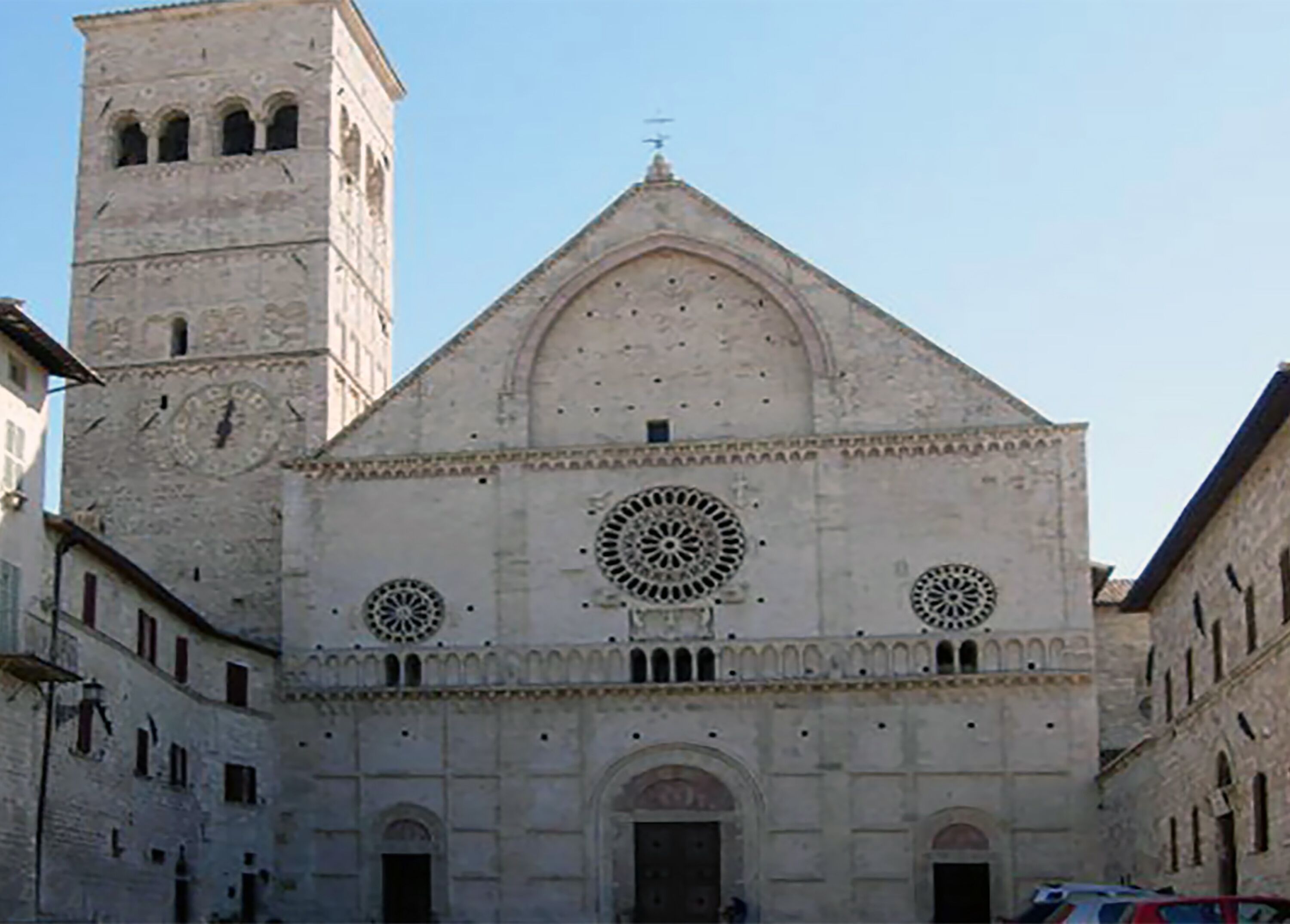 A historic building with a prominent clock tower and arched windows.