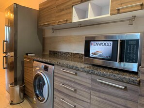 Fridge, microwave, oven, stovetop - Luxury Hurghada Self- Catering Apartments & Studios, Al Dau Heights  (Hurghada)