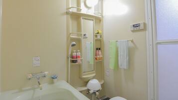 Separate bathtub and shower, hair dryer, slippers, towels