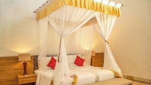 A double bed with a canopy, bedside tables, and a nightstand. - 2 BR Villa in Seminyak, 25sqm Private Pool, 5 mnts walk to shopping area for 6 (Seminyak)