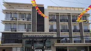 A multi-story building with balconies and a sign reading "L' MERIDIAN SUITES". - L Meridian Suites (Zamboanga)