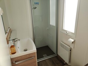 Shower, hair dryer, towels, toilet paper