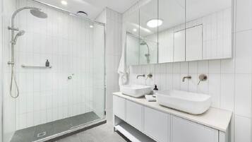 Combined shower/bathtub, hair dryer, towels, soap