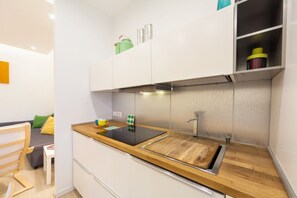 Fridge, toaster, dining tables