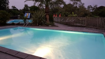 Seasonal outdoor pool, pool umbrellas, pool loungers