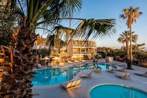 Seasonal outdoor pool, pool umbrellas, pool loungers