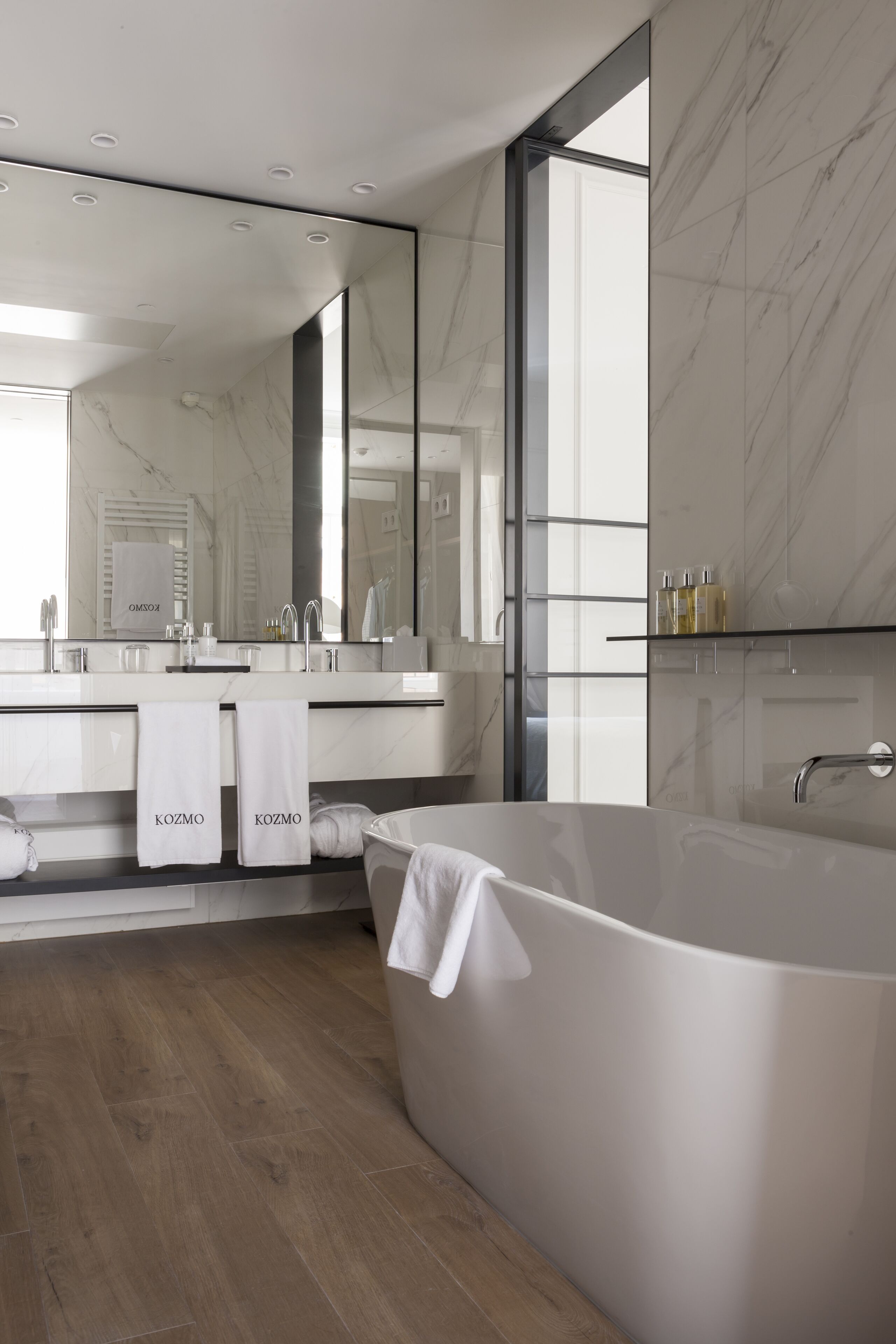 separate bathtub and shower, deep-soaking bathtub, designer toiletries