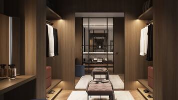 Un vestidor moderno y bien iluminado con paneles de madera, puertas espejadas y un banco central.