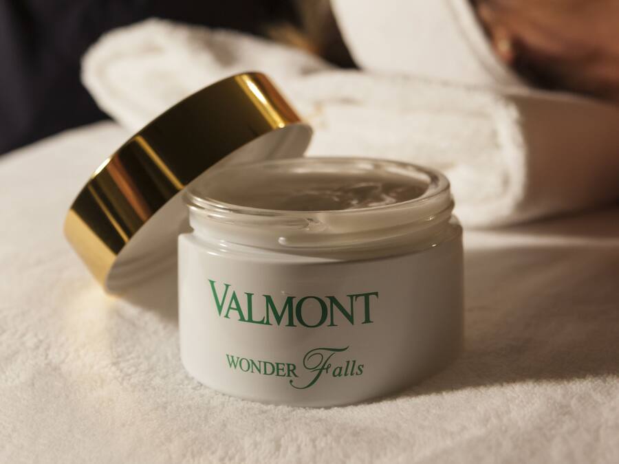 A jar of Valmont Wonder Falls cream on a white towel.