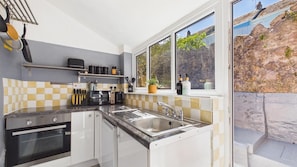 Fridge, microwave, oven, stovetop - Shell Cottage - 2 Bedroom Holiday Home - Tenby (Tenby)