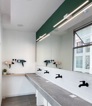 Shower, hair dryer, slippers, towels