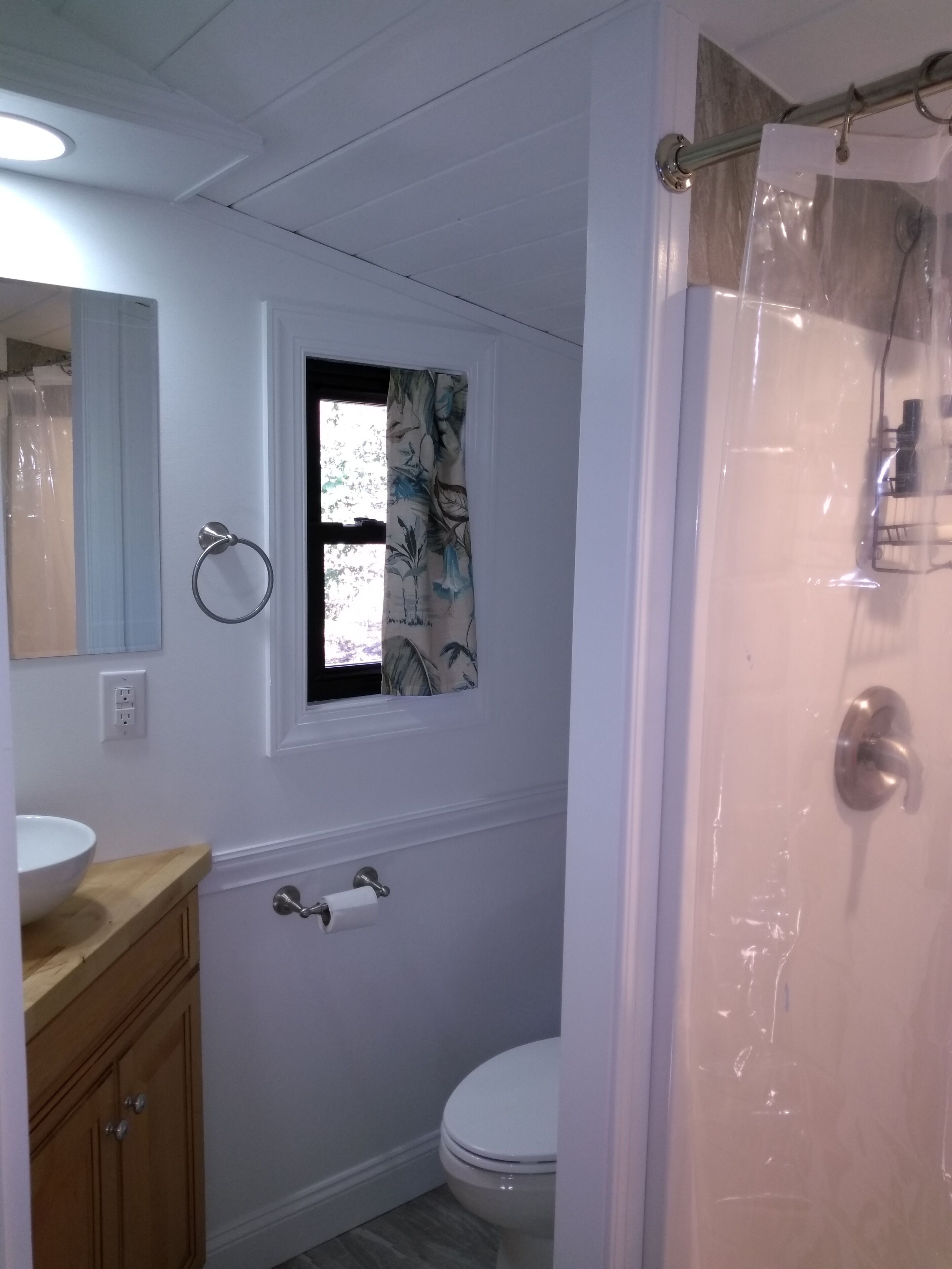 bathroom with stand in shower.