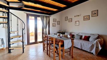 Apartment, 1 Bedroom (Split Level) | Living area | Flat-screen TV, toys