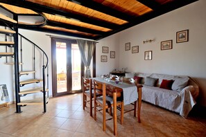 Apartment, 1 Bedroom (Split Level) | Living area | Flat-screen TV, toys - Megris Country Houses (Elafonisos)