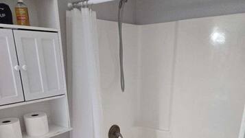 Combined shower/bathtub, hair dryer, towels, soap