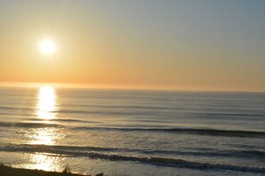 On the beach, sun-loungers