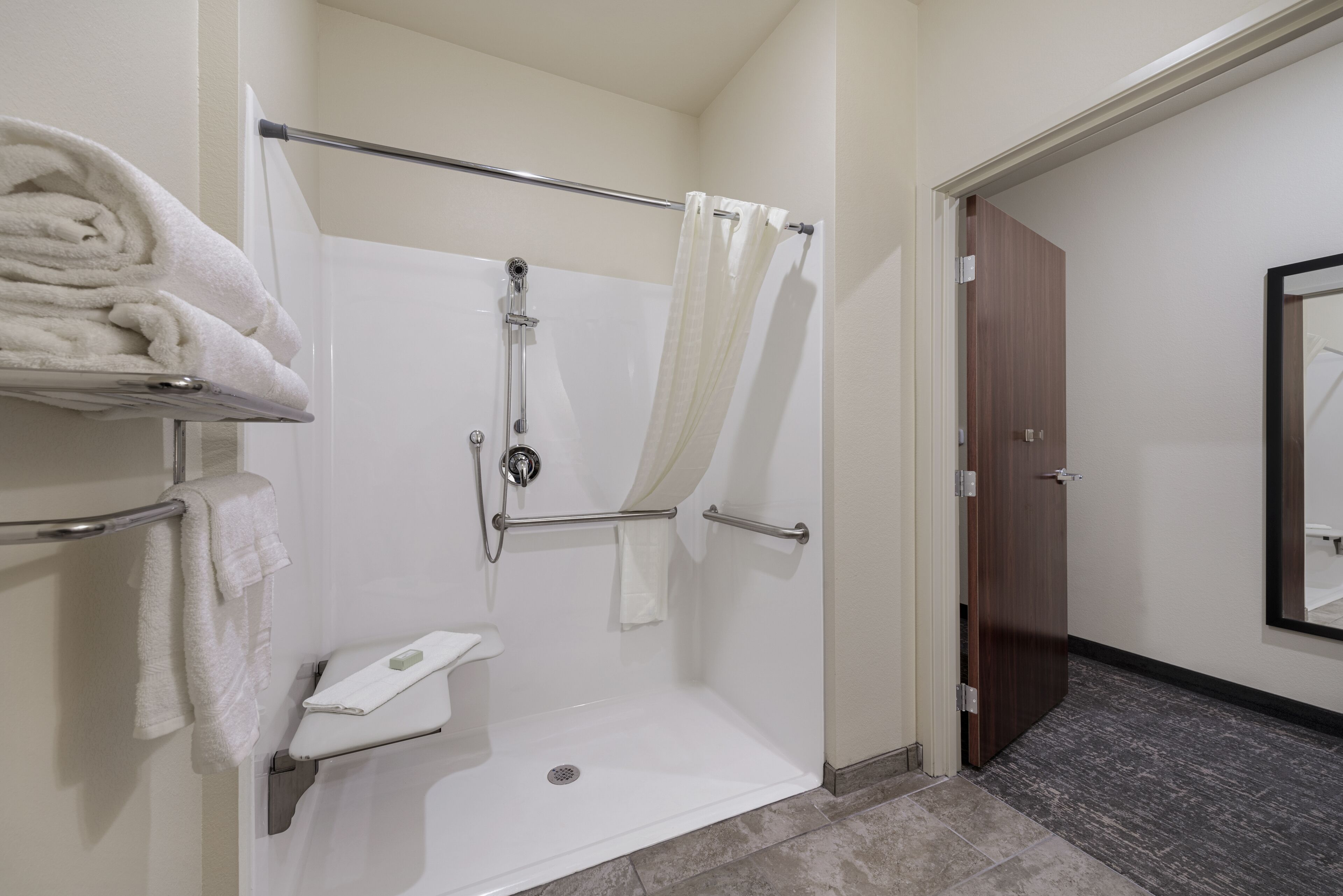 suite, 1 king bed with sofa bed, accessible, non smoking | bathroom | combined shower/bathtub, free toiletries, hair dryer, towels