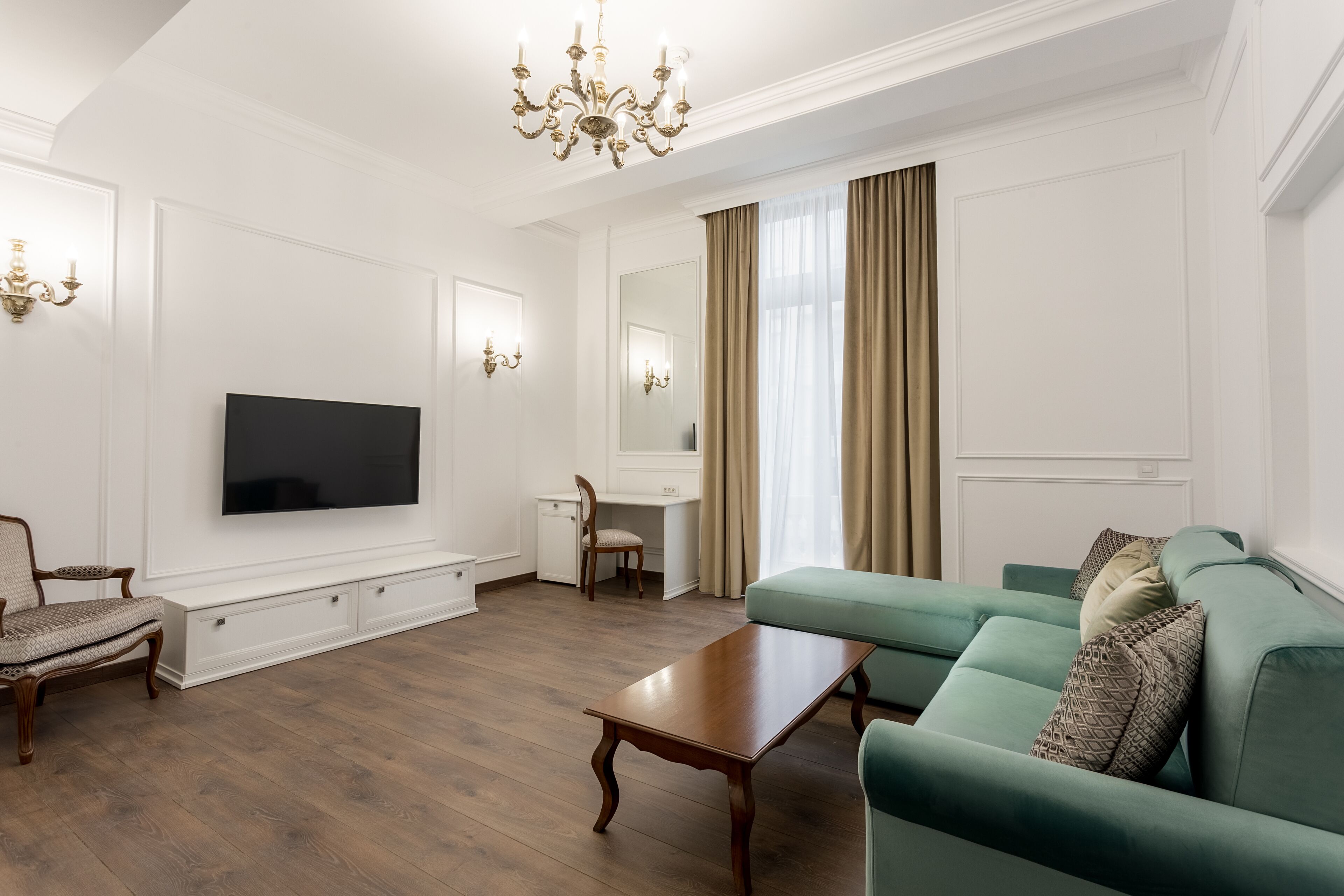 deluxe apartment, balcony | living room | 55-inch led tv with satellite channels, tv, heated floors