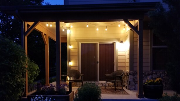 A covered outdoor area with a patio, two chairs, and a potted plant. - Quiet Loveland Escape – Close to Downtown, Parks & I-25 (Loveland)