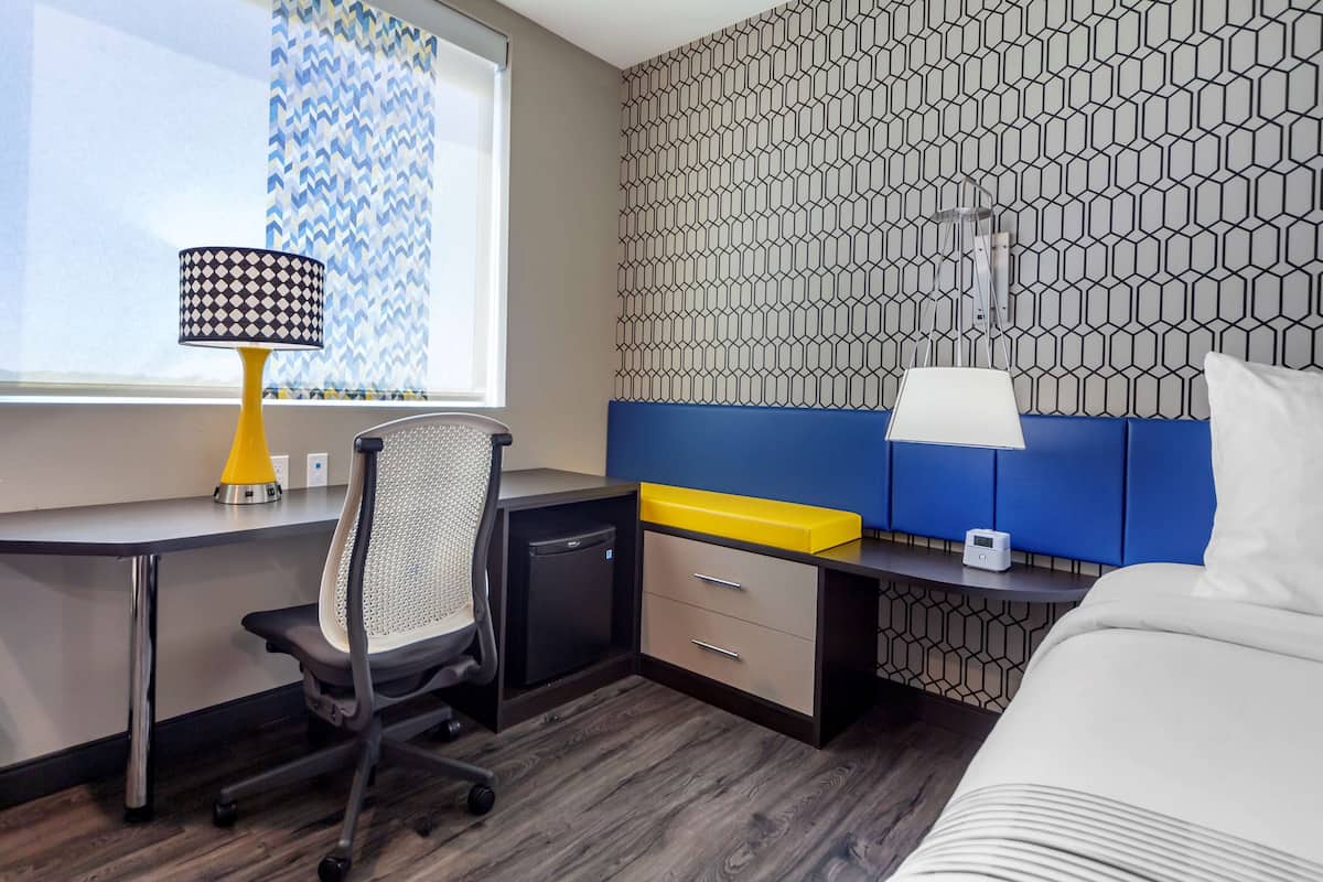 Premium bedding, pillowtop beds, laptop workspace, blackout drapes