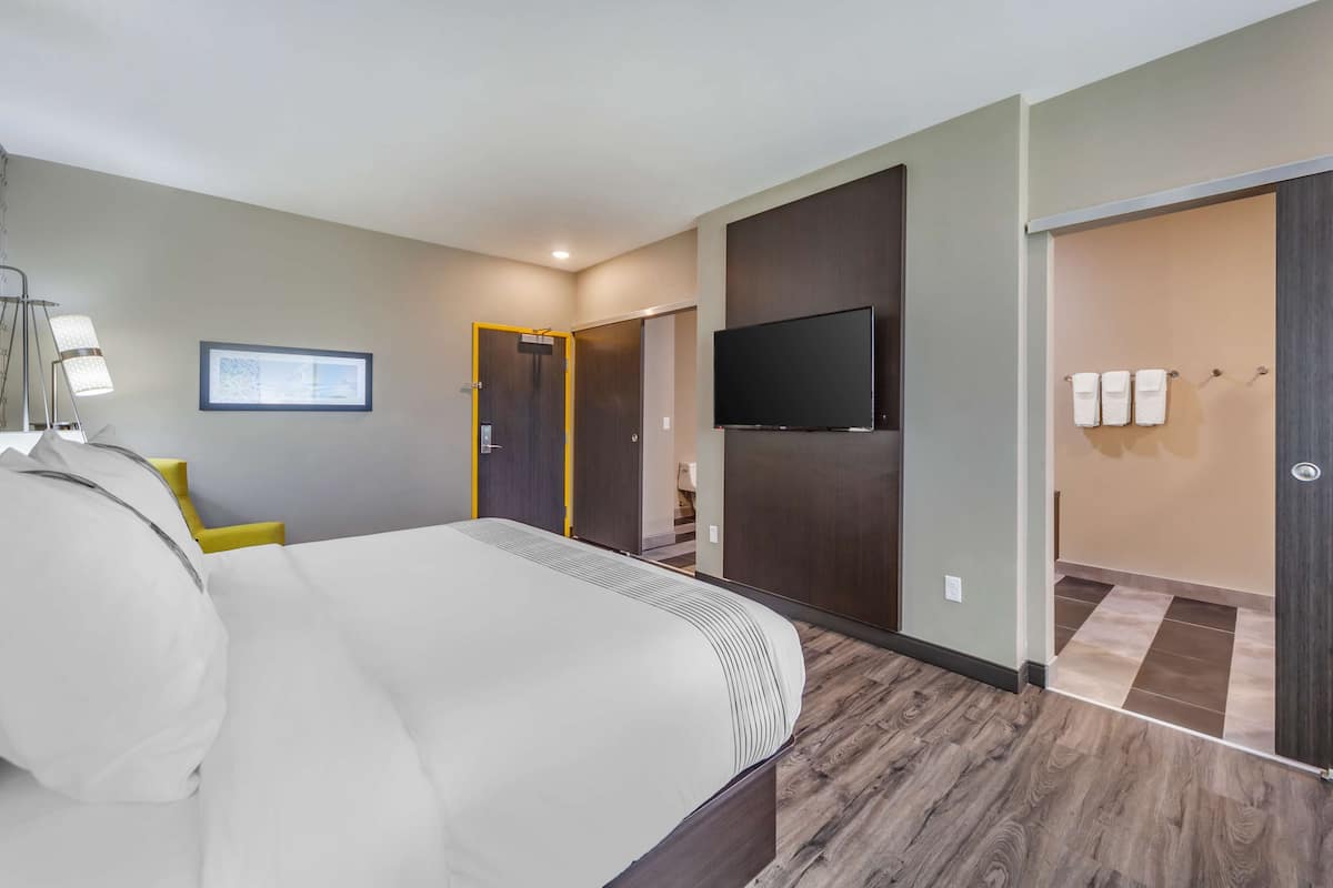 Premium bedding, pillowtop beds, laptop workspace, blackout drapes