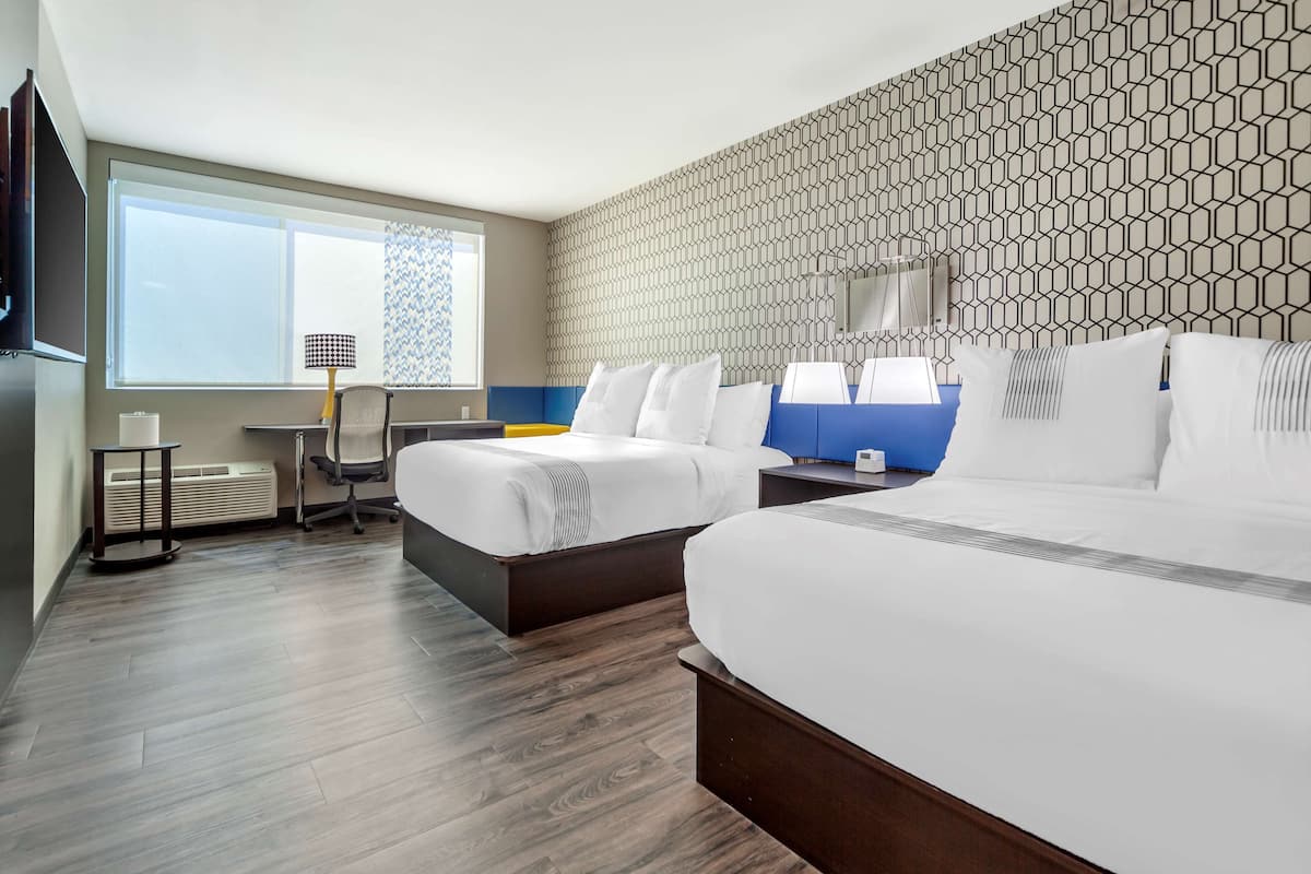 Premium bedding, pillowtop beds, laptop workspace, blackout drapes