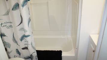 Combined shower/tub, hair dryer, towels, soap
