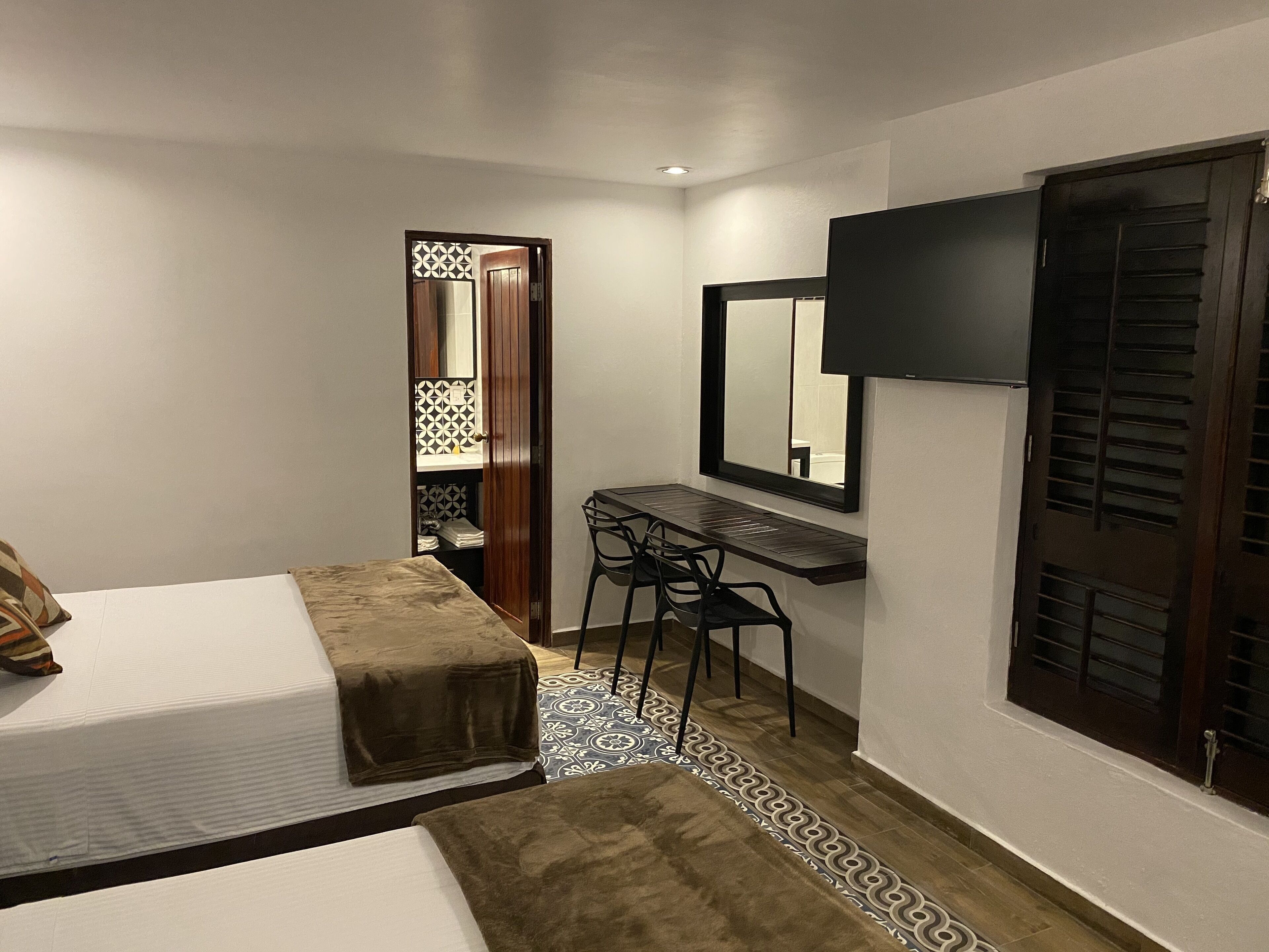 deluxe room, 2 double beds | iron/ironing board, free wifi, bed sheets