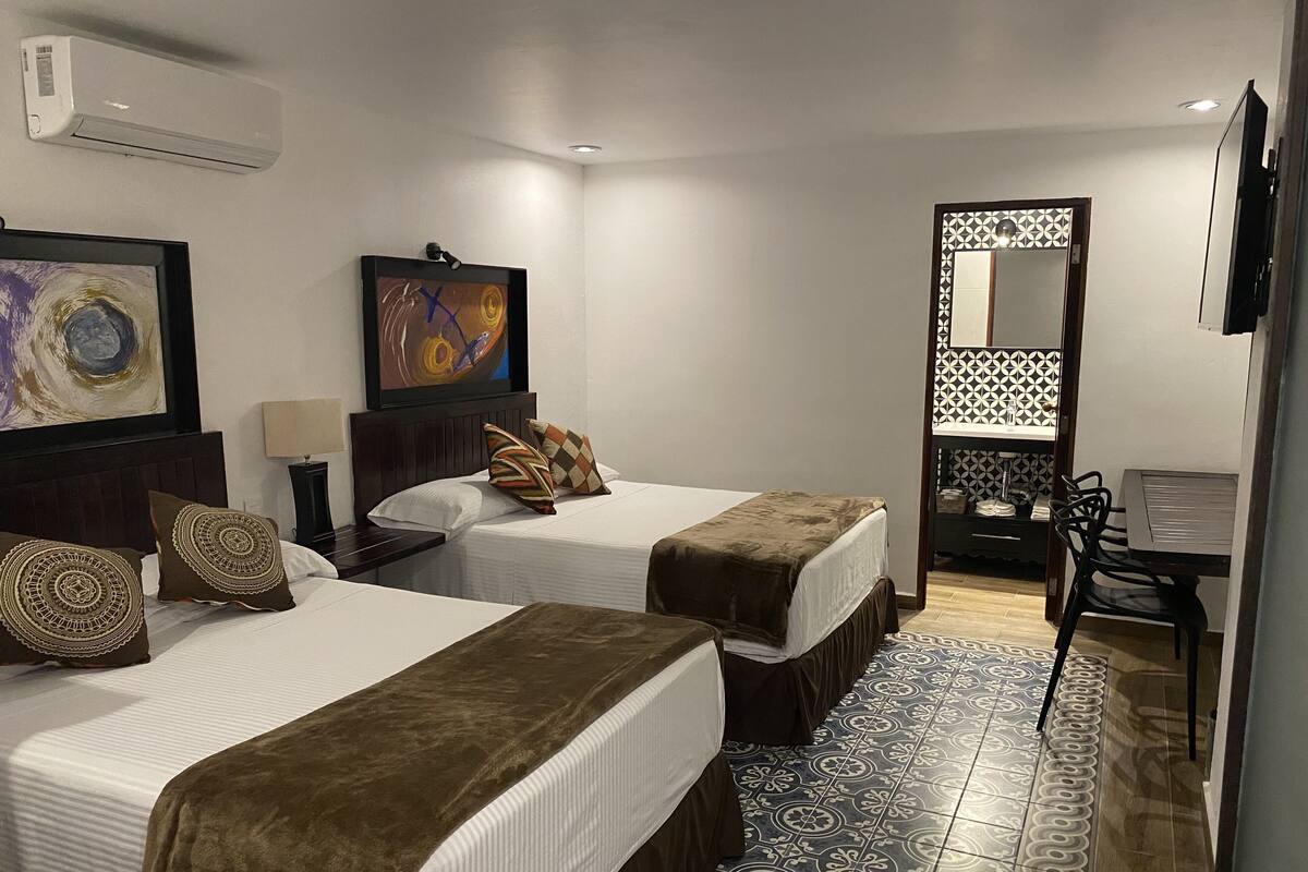 Deluxe Room, 2 Double Beds | Iron/ironing board, WiFi (free), bed sheets