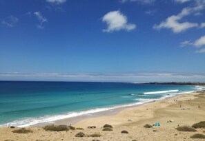 On the beach, sun-loungers