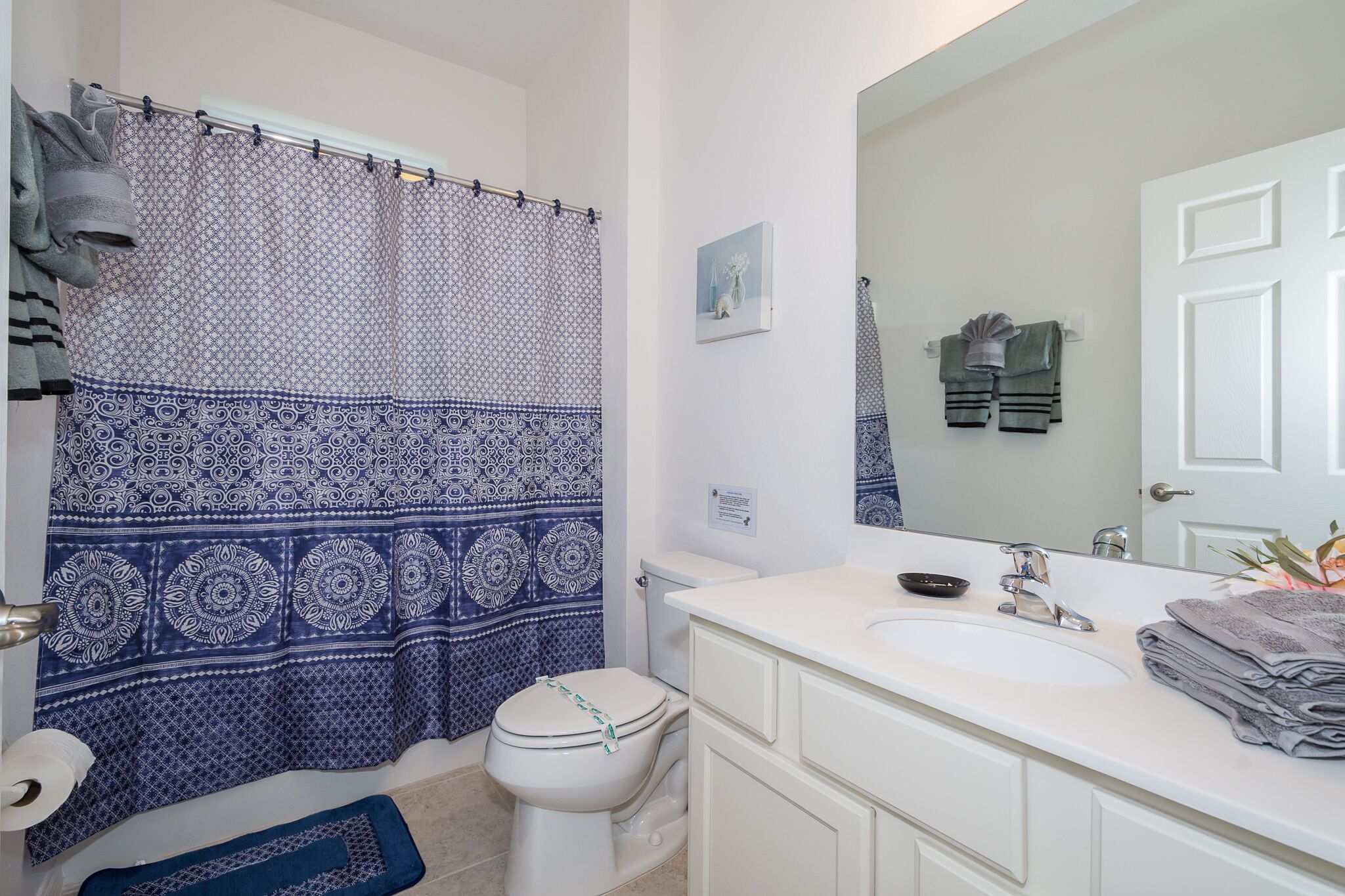 combined shower/bathtub, hair dryer, towels, soap