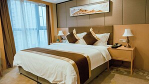 A hotel room with a large bed, two bedside tables, a nightstand, a painting on the wall, and a window with curtains. - Days Inn by Wyndham Business Place Sichuan Bazhong (Bazhong)