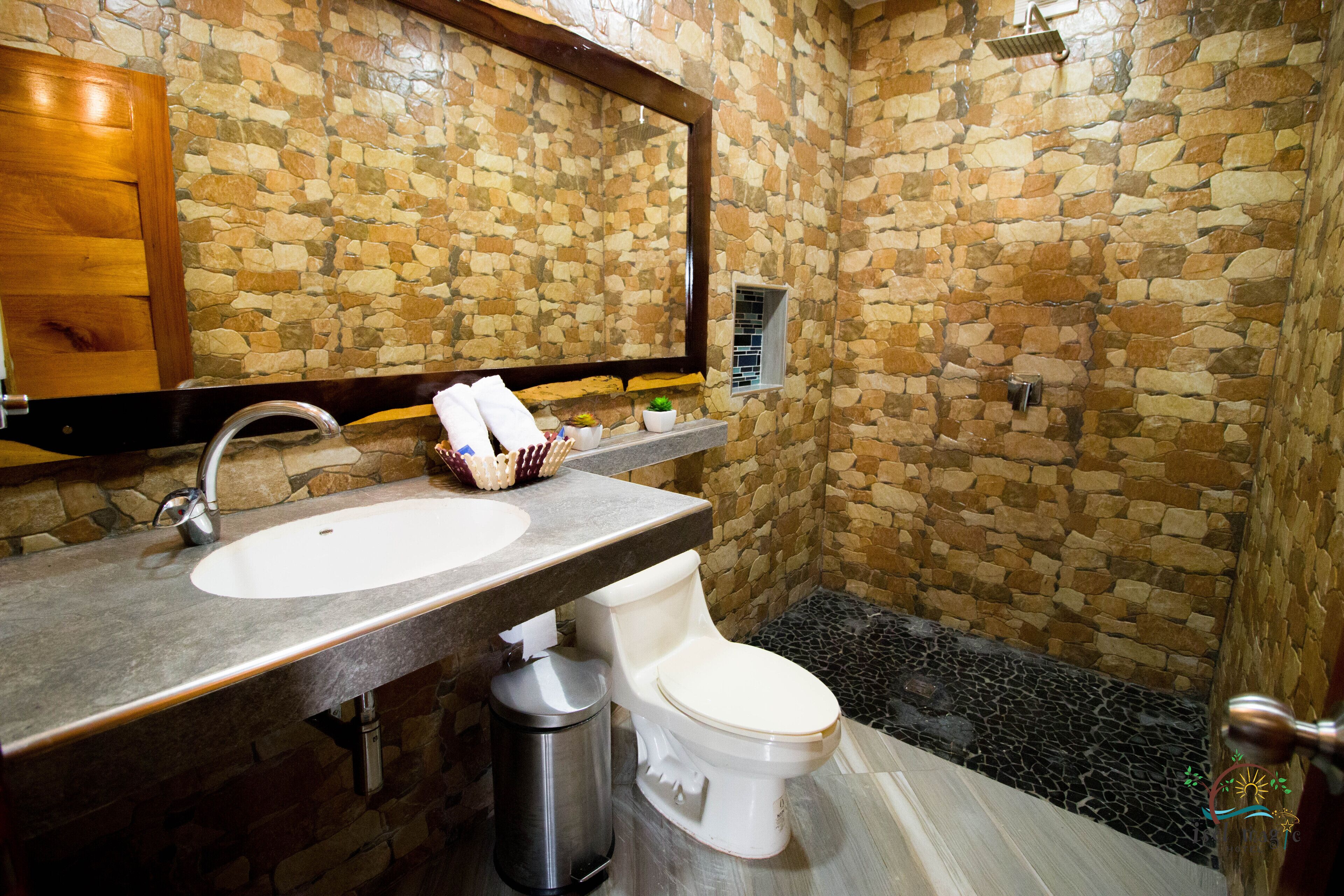 luxury room, 1 king bed | bathroom | shower, towels, soap, shampoo