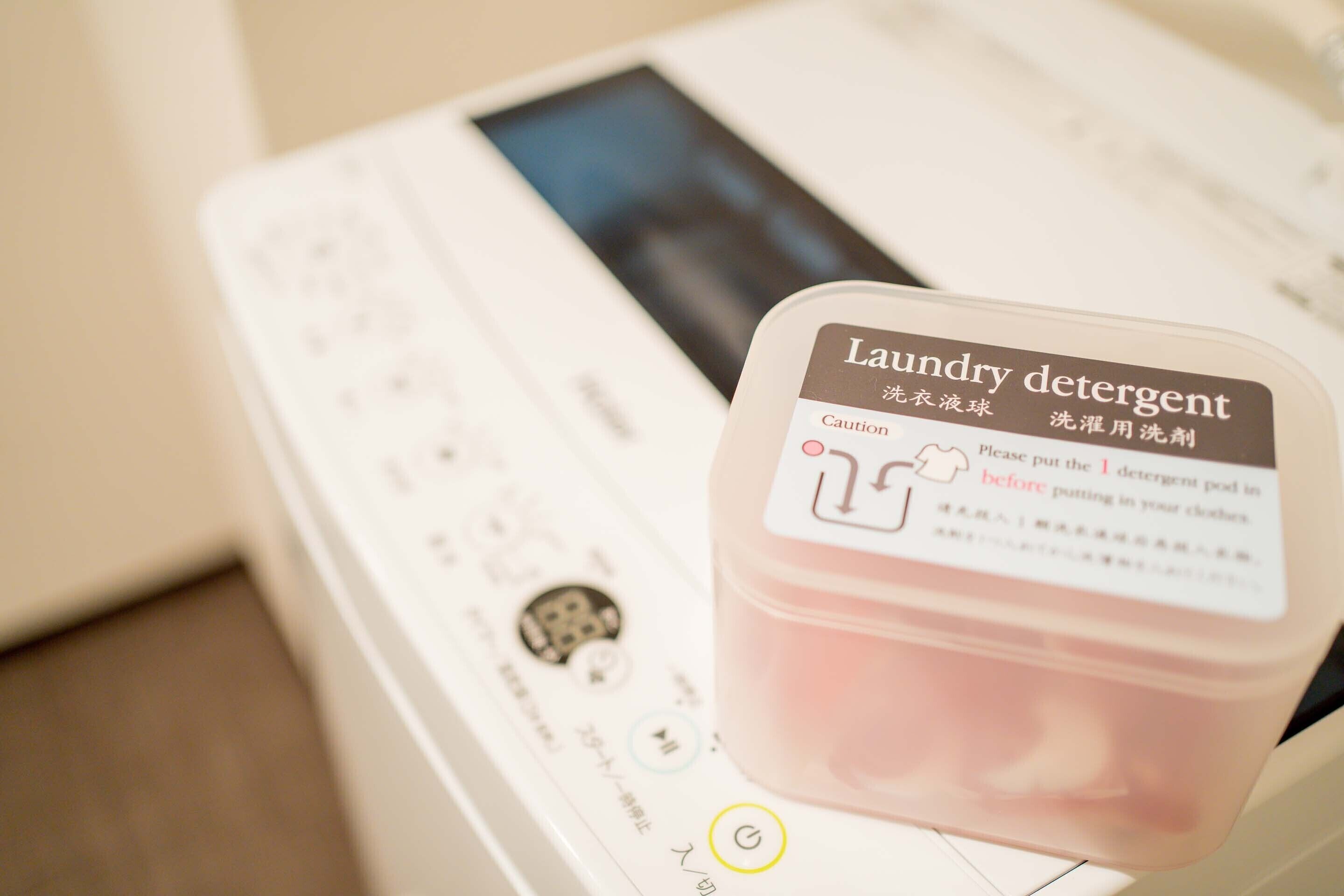 A laundry machine with a detergent pod on top.