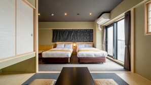 A hotel room with two beds, a large window, and a sliding door. - RESI STAY ANDON  (Kyoto)