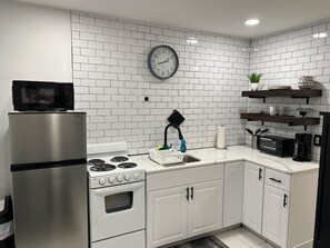 Fridge, microwave, stovetop, coffee/tea maker