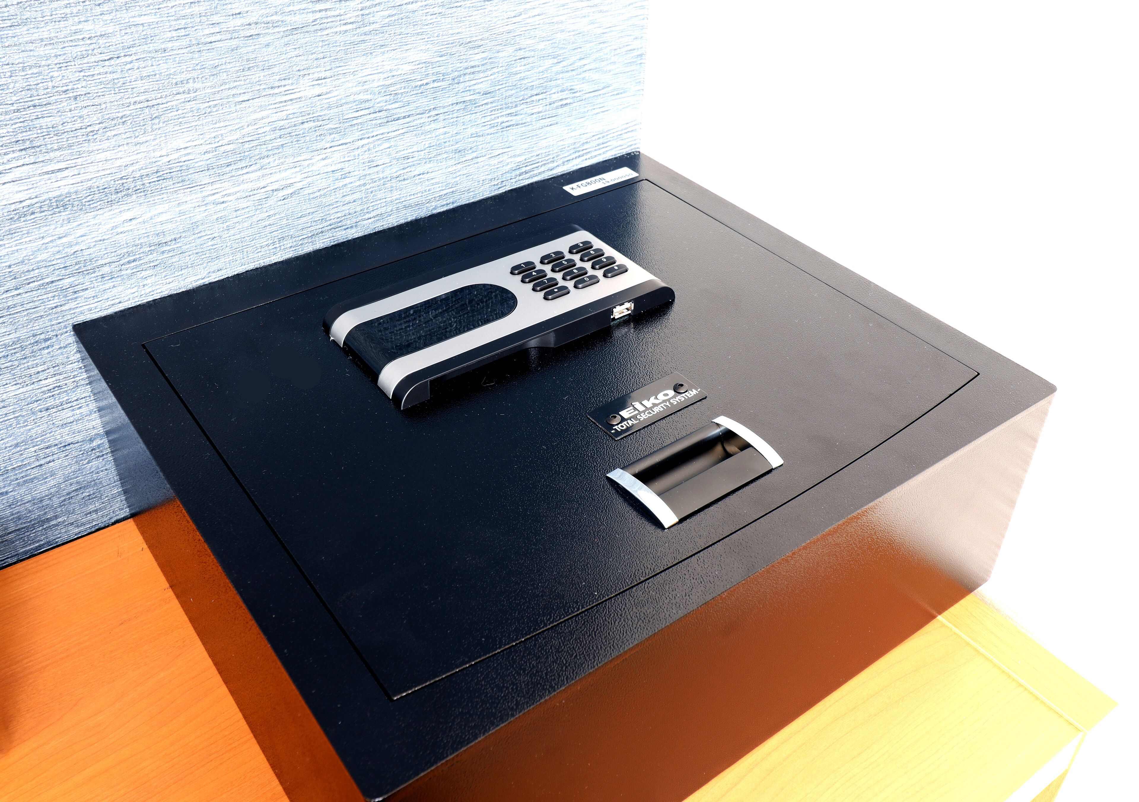 A safe deposit box with a keypad and a card slot.