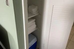 A narrow hallway with a white door on the right and a green wall on the left. - Downtown Sarasota Florida Vacation Rental, 2BR/2BA Apt, 5–10min to Lido & Siesta (Sarasota)