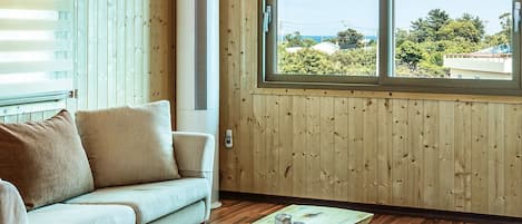 Premium Condo | Living room | 34-inch flat-screen TV with cable channels, TV, heated floors