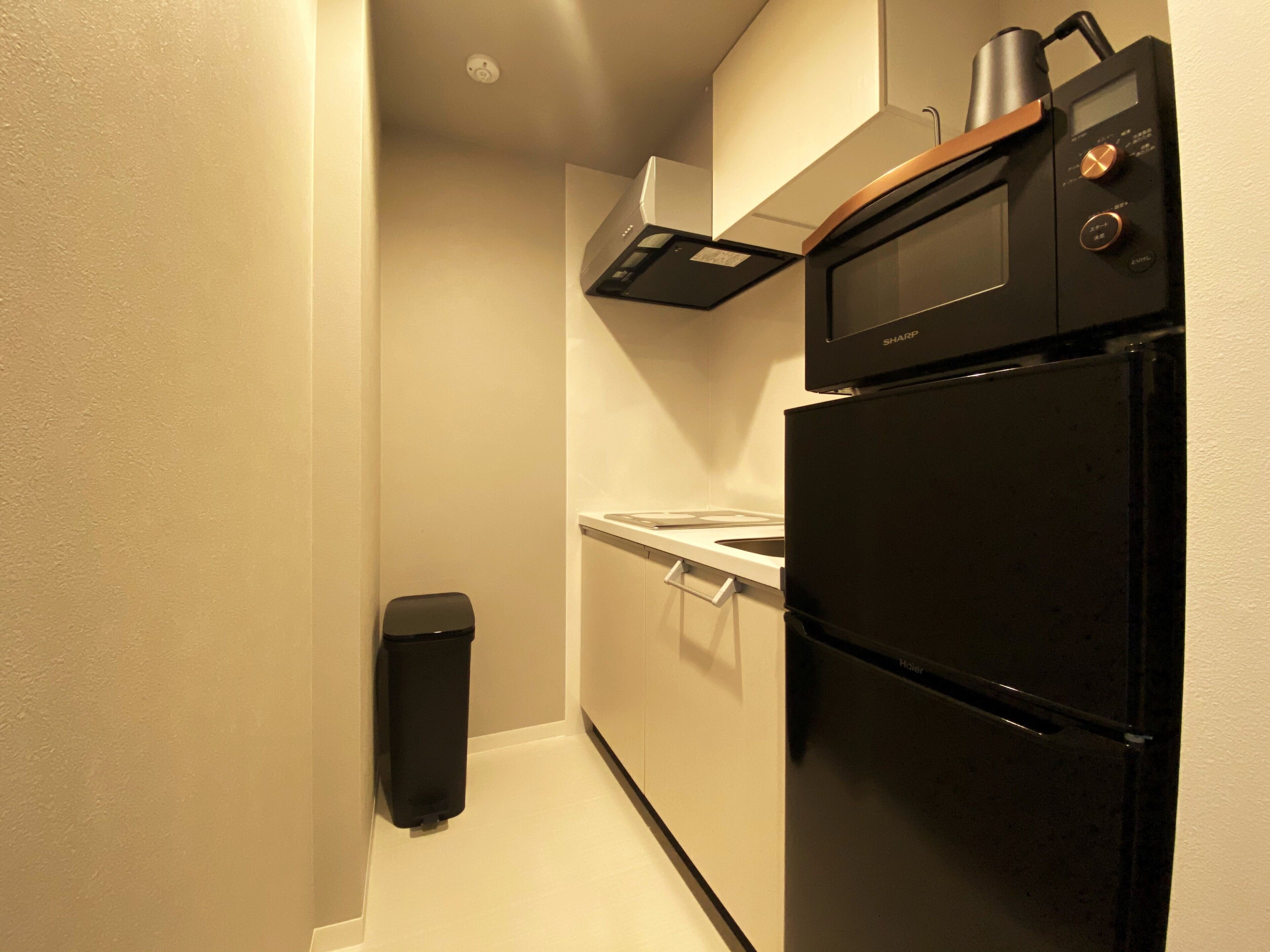 fridge, microwave, electric kettle, cookware/dishes/utensils