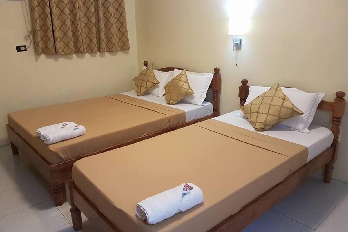 Triple Room | Iron/ironing board (on request), bed sheets